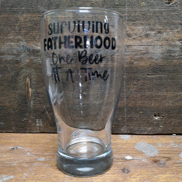 'Surviving Fatherhood, One Beer at a Time' Pint Glass